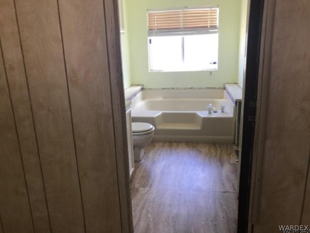 1354 Guthrie Road Golden Valley, AZ 86413 - Photo 6 of 6 a bathroom with a toilet sink and a bathtub