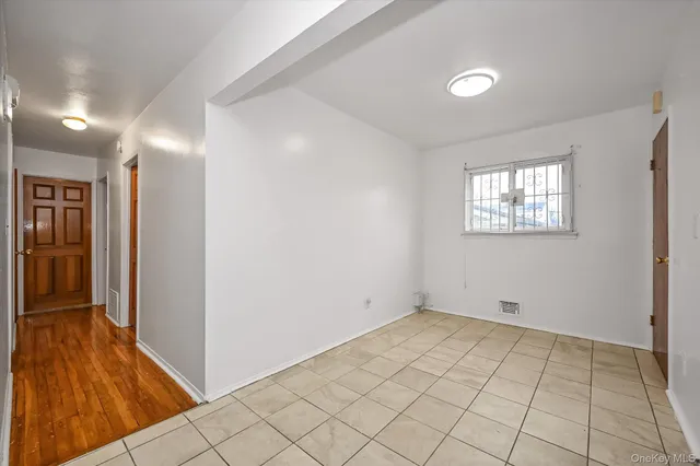 a view of an empty room and window