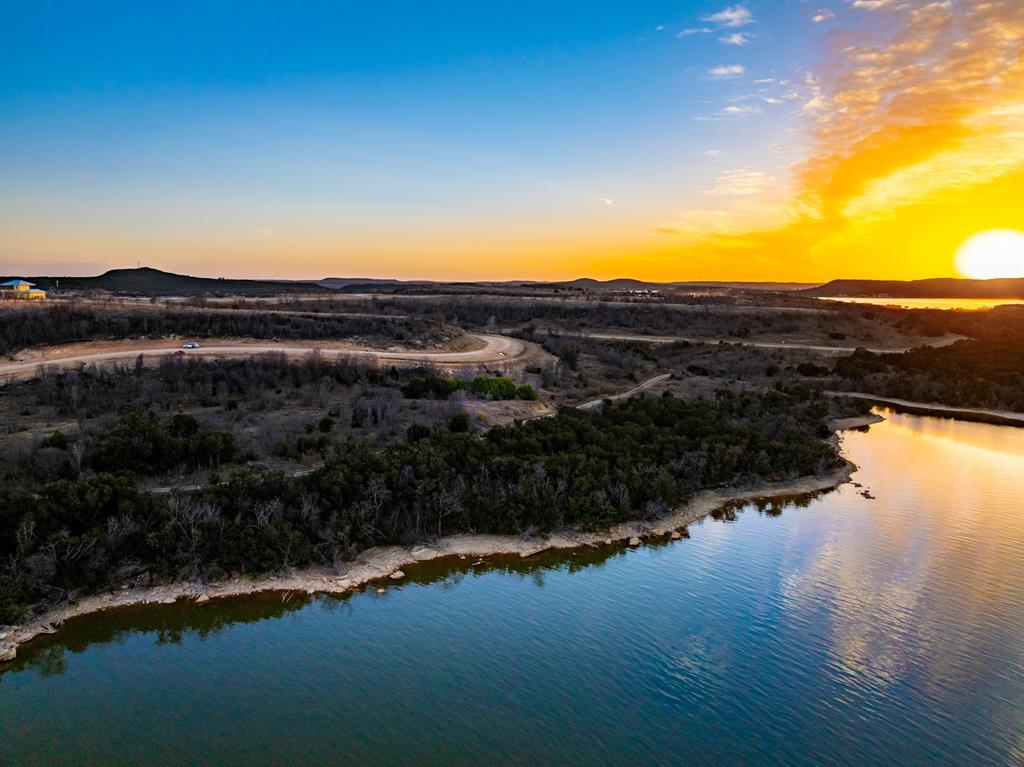 Tbd Shawnee Street Graham, TX 76450 - Photo 2 of 6 a view of a lake and a yard