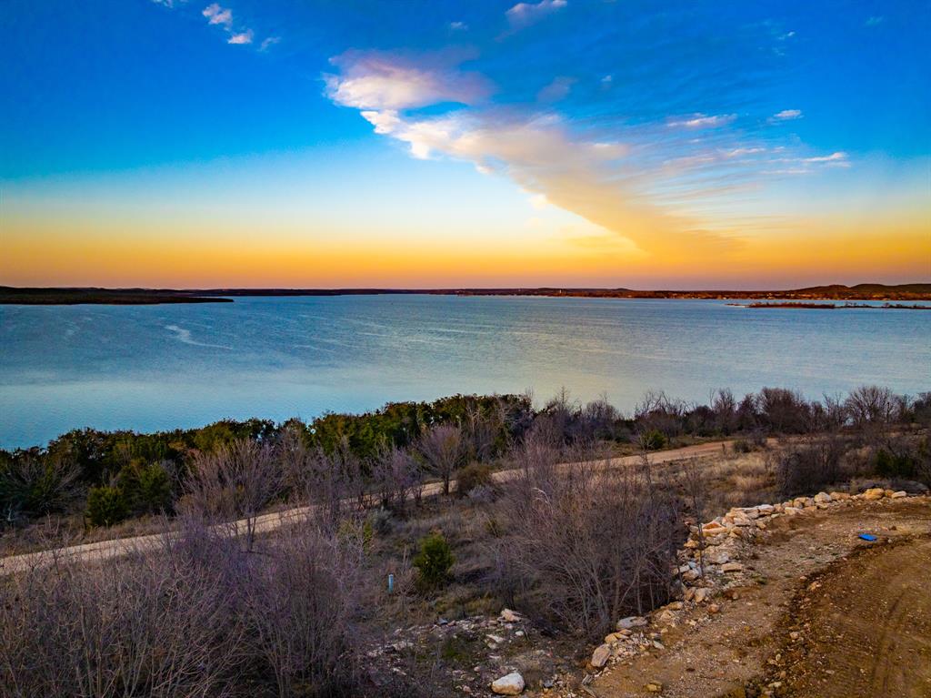 Tbd Shawnee Street Graham, TX 76450 - Photo 6 of 6 a view of a lake and sunset