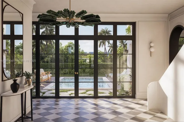 a view of a porch with a floor to ceiling window and front door