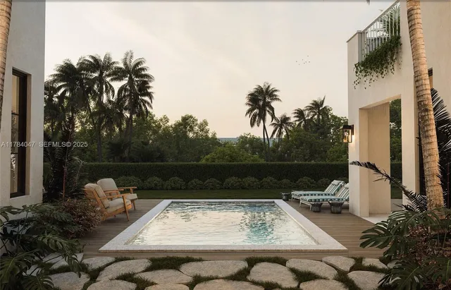 a view of a swimming pool with a patio