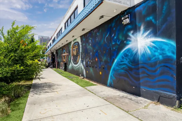 a view of a parked cars in front of a building