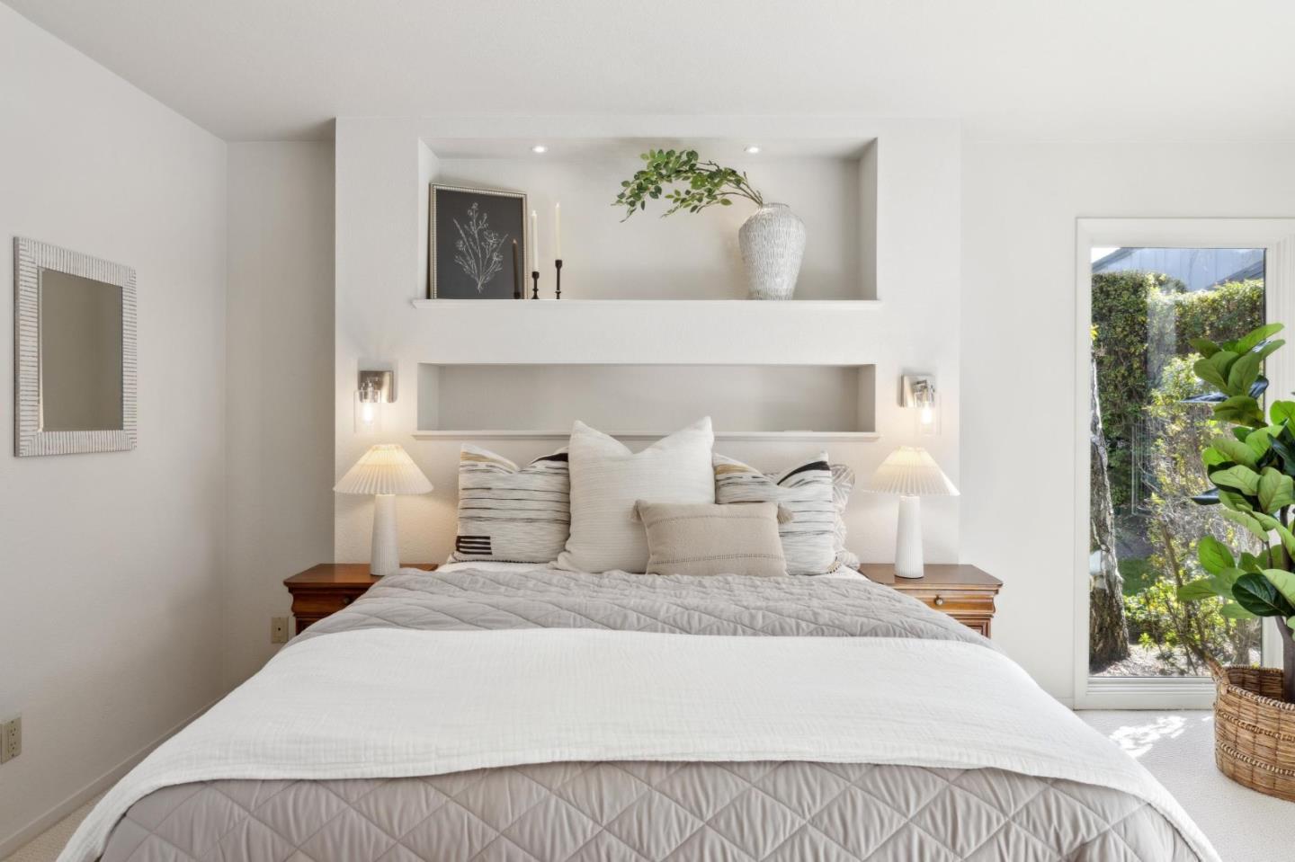 28064 Heron Court Carmel, CA 93923 - Photo 11 of 30 a bedroom with a bed and a potted plant