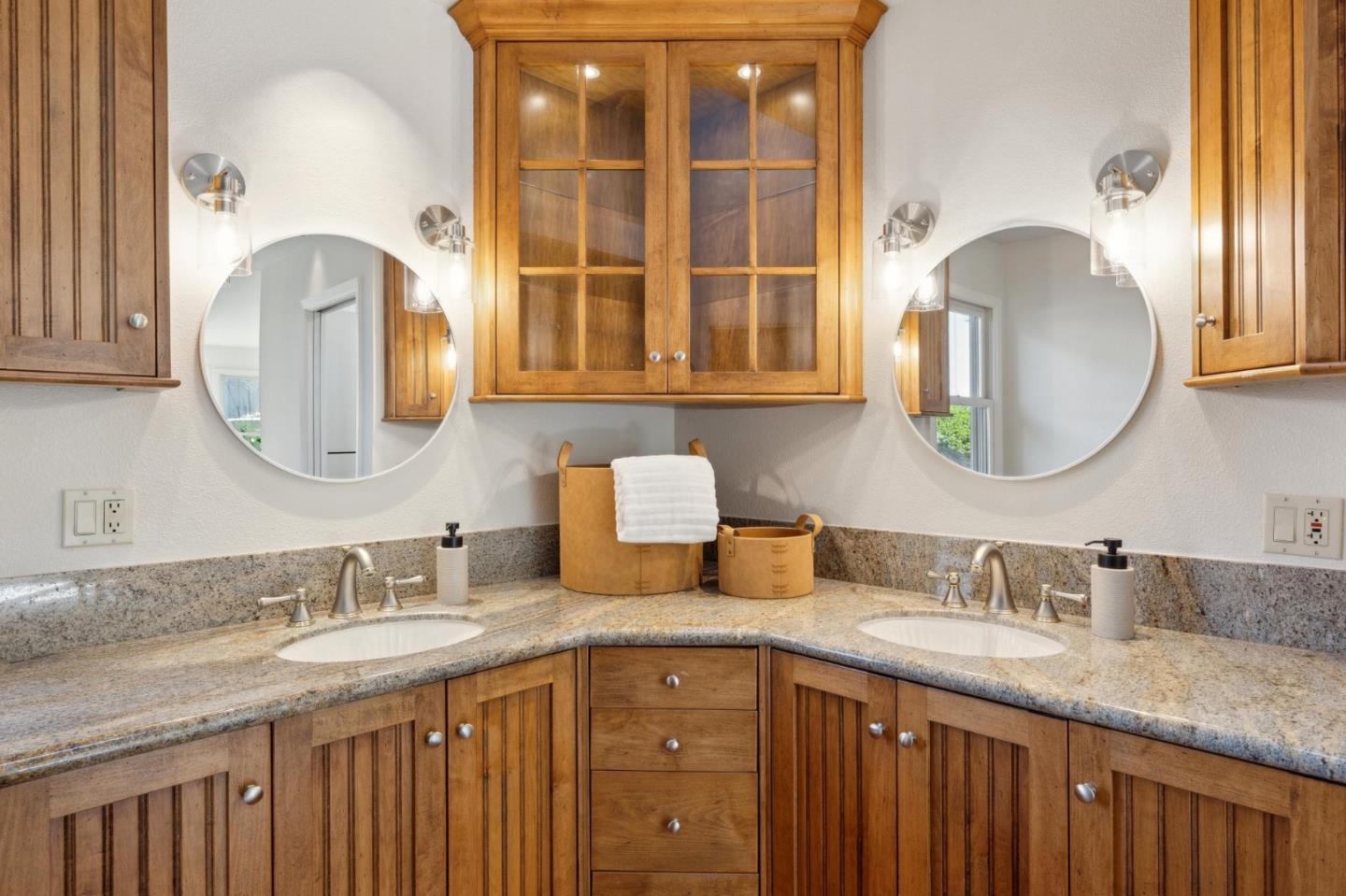 28064 Heron Court Carmel, CA 93923 - Photo 15 of 30 a bathroom with a granite countertop double vanity and a mirror