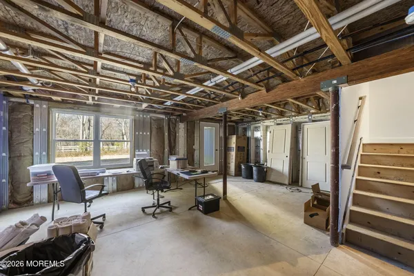 a view of a livingroom with couch and chairs