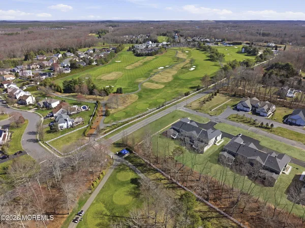 a aerial view of a house with a garden and deck