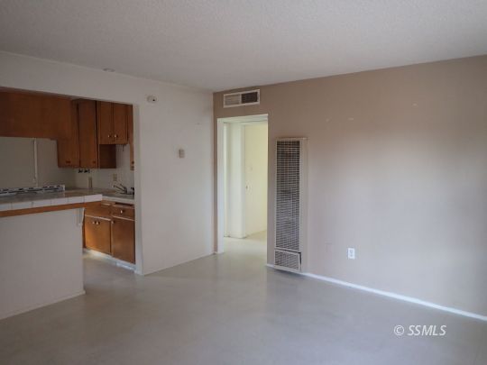 520 Commercial Avenue Ridgecrest, CA 93555 - Photo 9 of 15 a kitchen with a refrigerator and a sink
