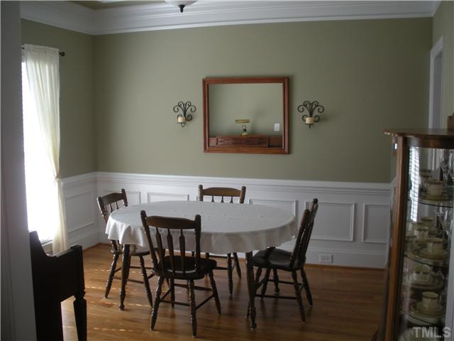 1124 Colonial Club Road Wake Forest, NC 27587 - Photo 10 of 25 Hardwood floors....chairrails, crown mouldings, sunlit! Dining Room