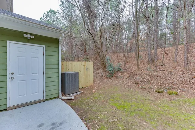 a view of a wooden door and a yard