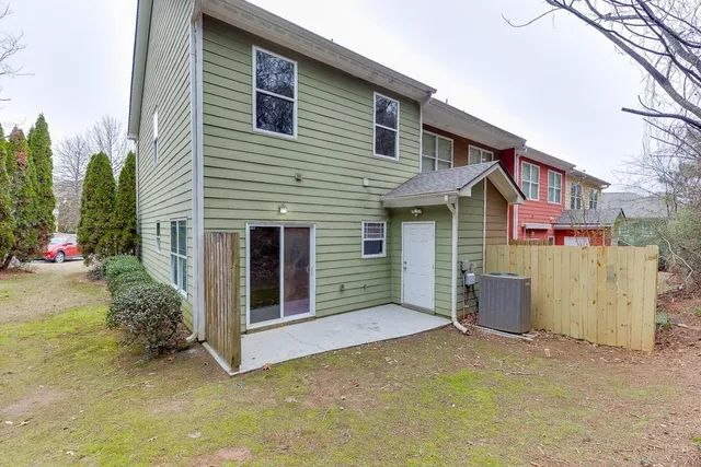 a view of a house with a yard and garage