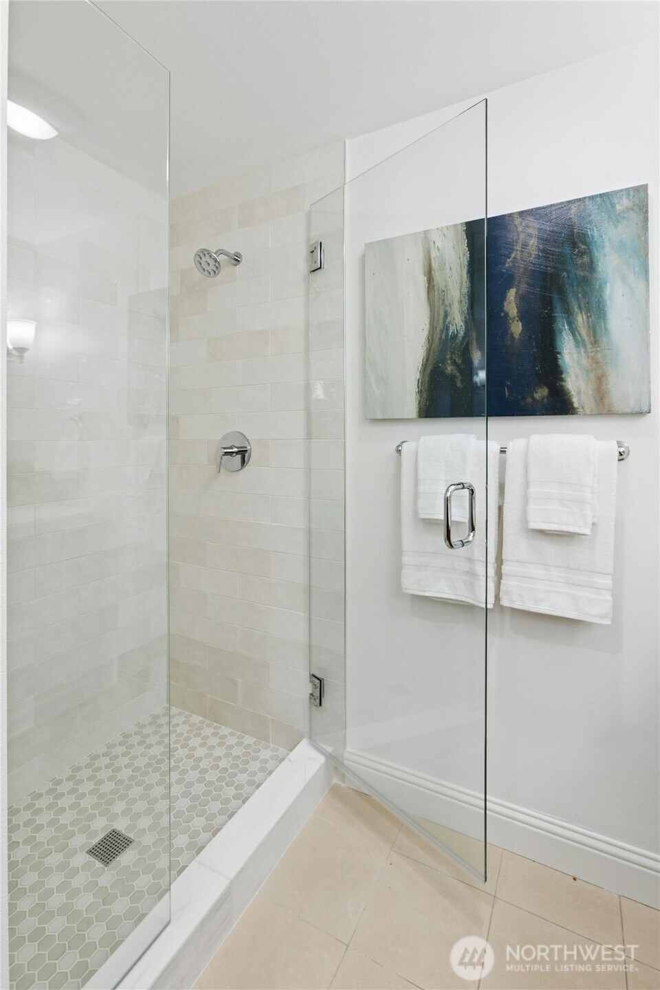 18707 Southeast Newport Way, Unit 102 Issaquah, WA 98027 - Photo 17 of 34 a bathroom with a shower and a sink