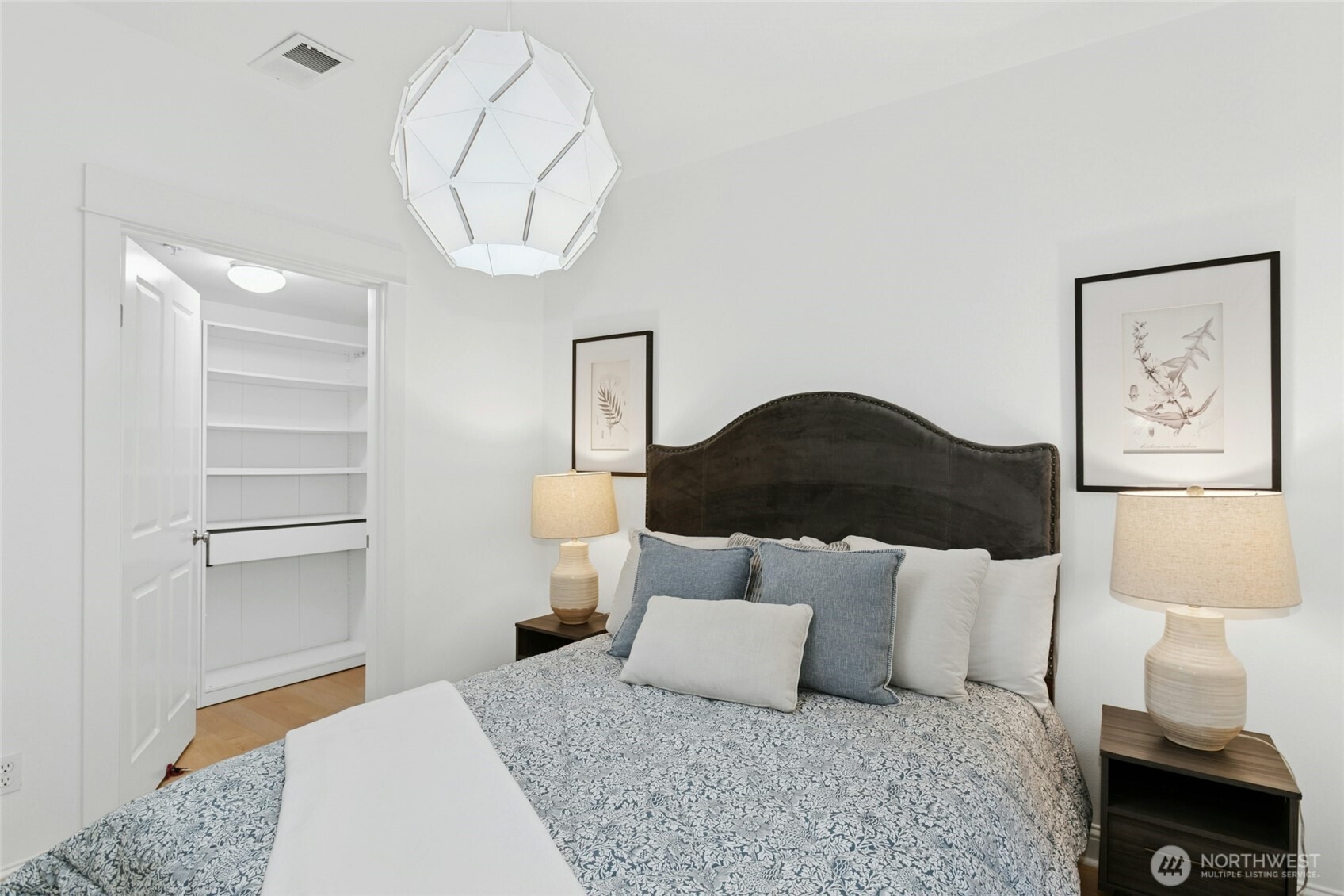 18707 Southeast Newport Way, Unit 102 Issaquah, WA 98027 - Photo 19 of 34 a bedroom with a bed and a painting on the wall