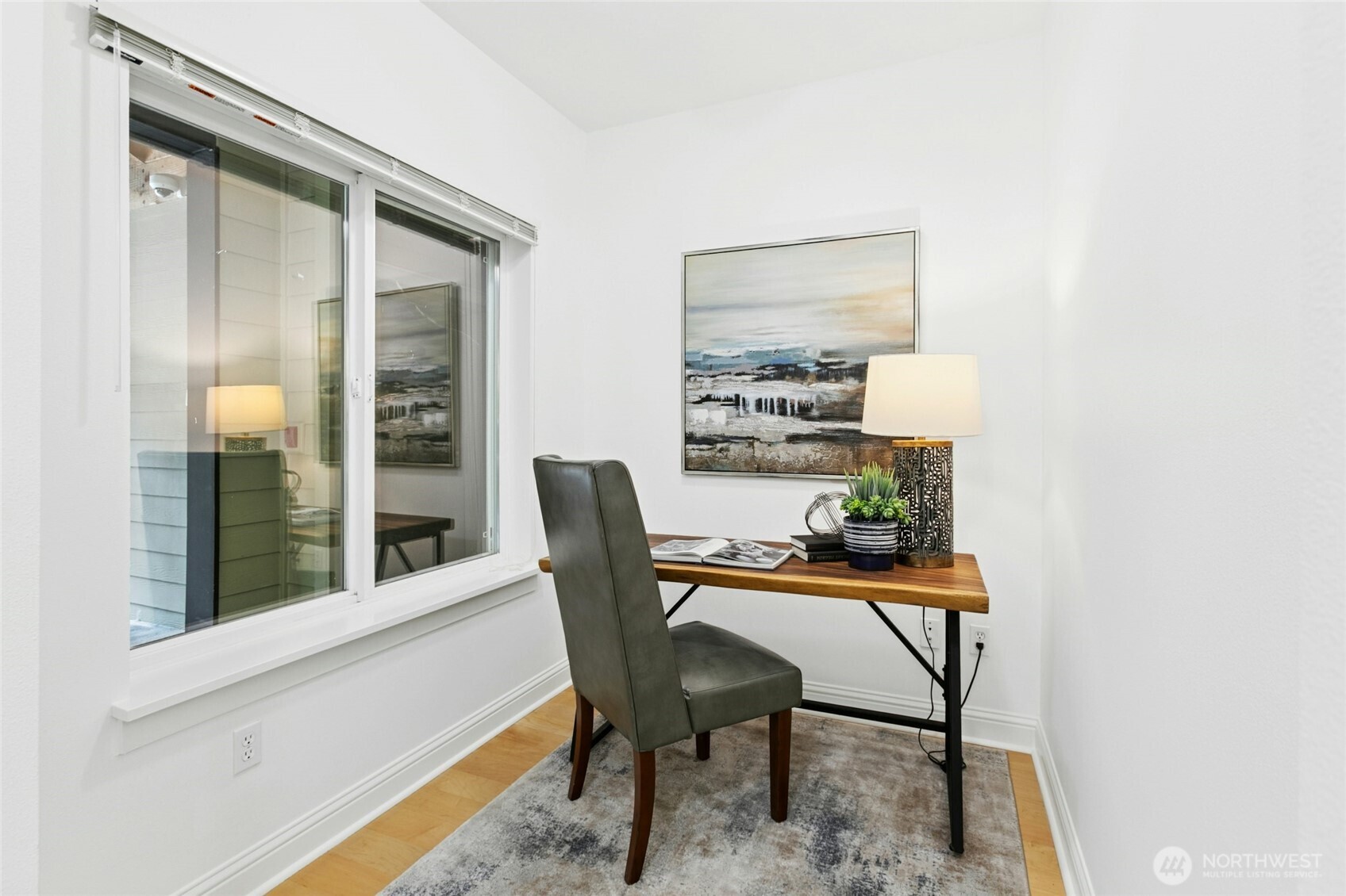 18707 Southeast Newport Way, Unit 102 Issaquah, WA 98027 - Photo 22 of 34 a dining room with furniture and a window