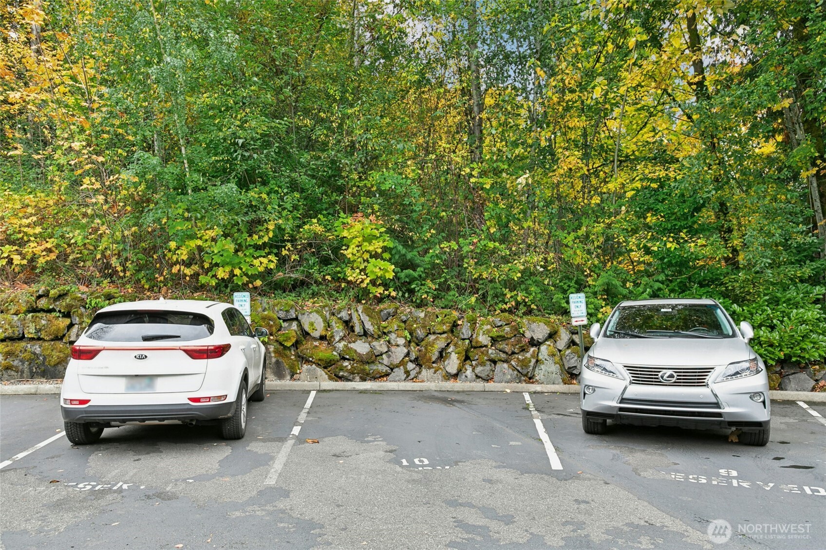 18707 Southeast Newport Way, Unit 102 Issaquah, WA 98027 - Photo 24 of 34 a car parked in a parking space