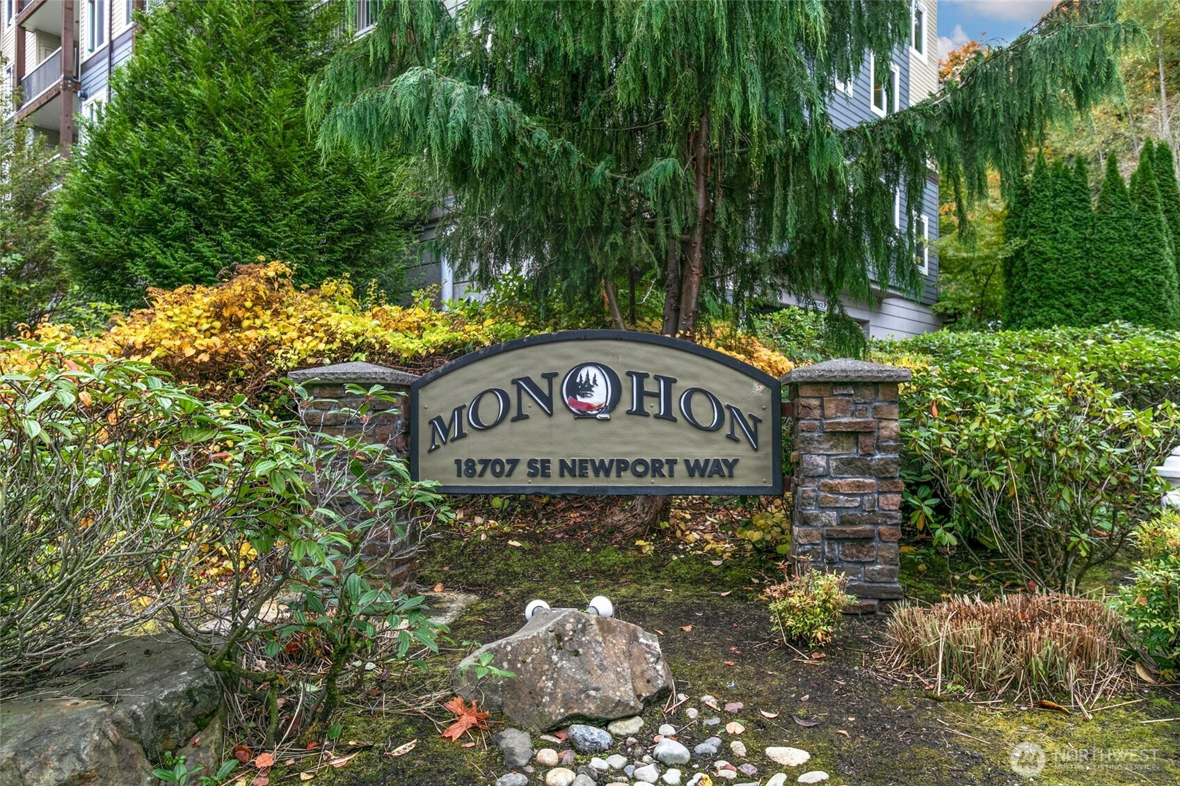 18707 Southeast Newport Way, Unit 102 Issaquah, WA 98027 - Photo 25 of 34 a sign that is on a tree