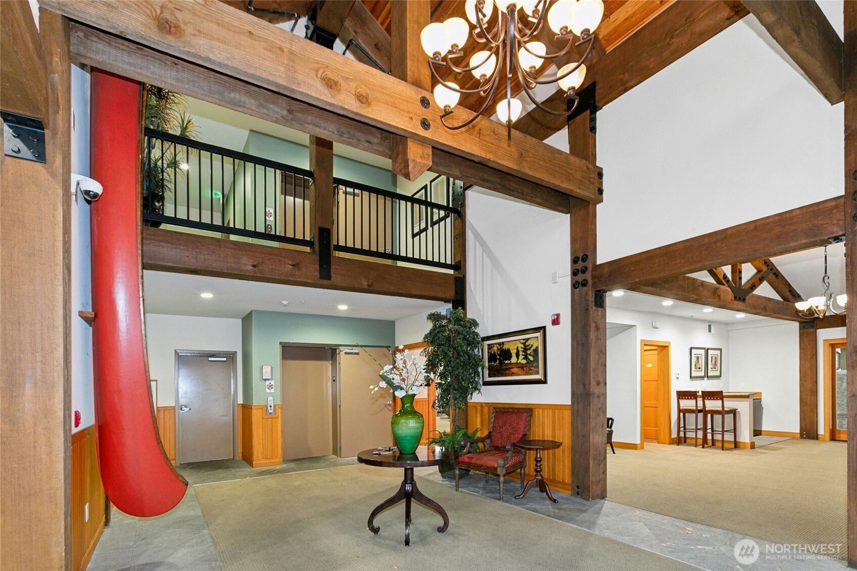 18707 Southeast Newport Way, Unit 102 Issaquah, WA 98027 - Photo 26 of 34 a view of a house with a barbeque and wooden stairs