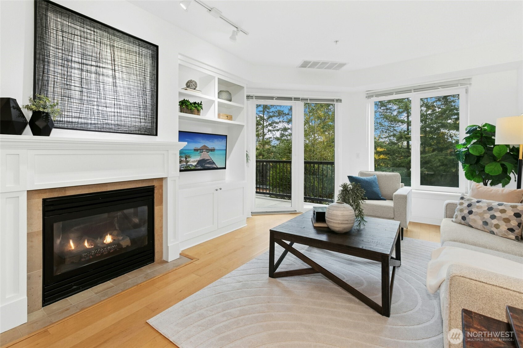 18707 Southeast Newport Way, Unit 102 Issaquah, WA 98027 - Photo 4 of 34 a living room with furniture and a fireplace