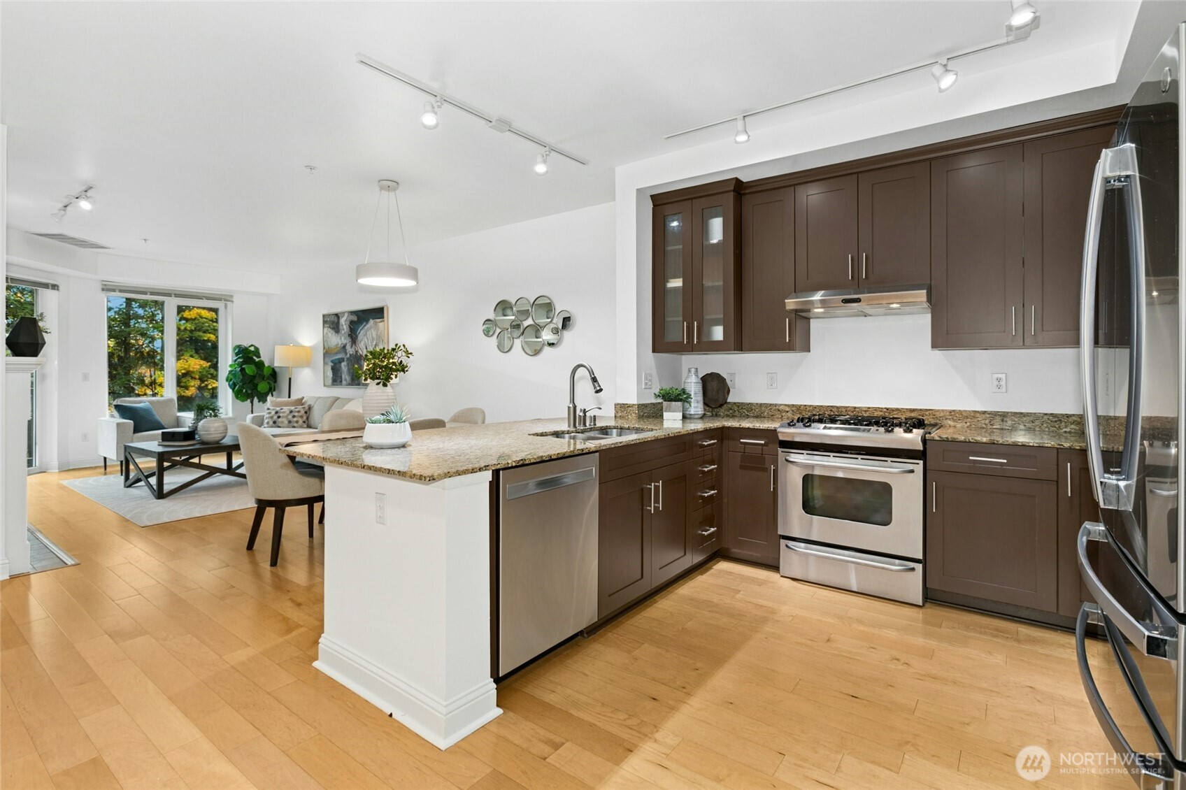 18707 Southeast Newport Way, Unit 102 Issaquah, WA 98027 - Photo 9 of 34 a kitchen with a sink and cabinets