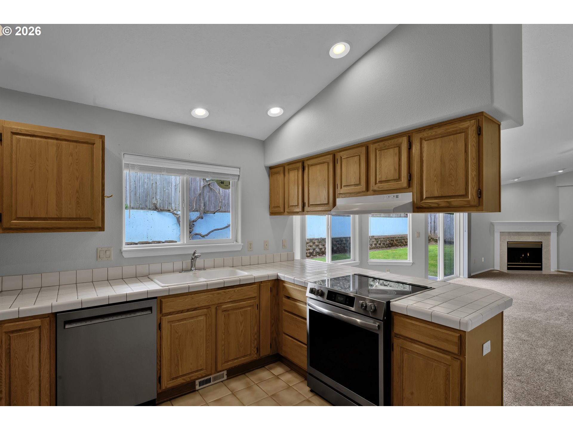4159 Kurth Street South Salem, OR 97302 - Photo 15 of 37 a kitchen with a sink stove and cabinets