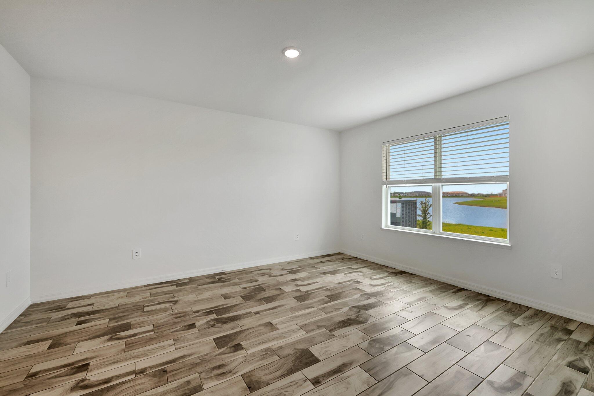 9398 Serapis Way Port St. Lucie, FL 34987 - Photo 14 of 50 a view of an empty room and window