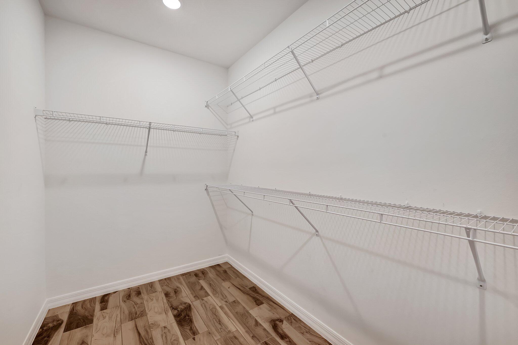 9398 Serapis Way Port St. Lucie, FL 34987 - Photo 20 of 50 a view of a room with racks on the wall