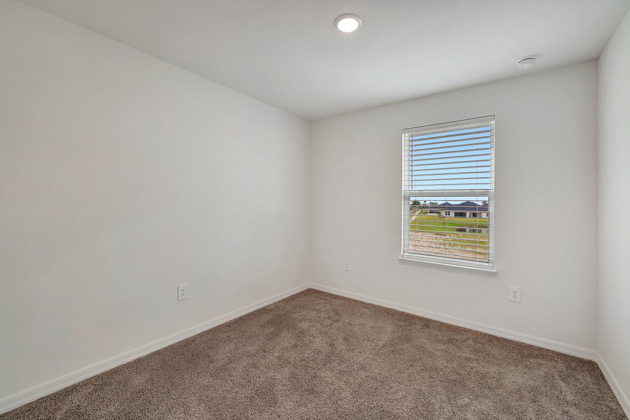 9398 Serapis Way Port St. Lucie, FL 34987 - Photo 23 of 50 an empty room with a window