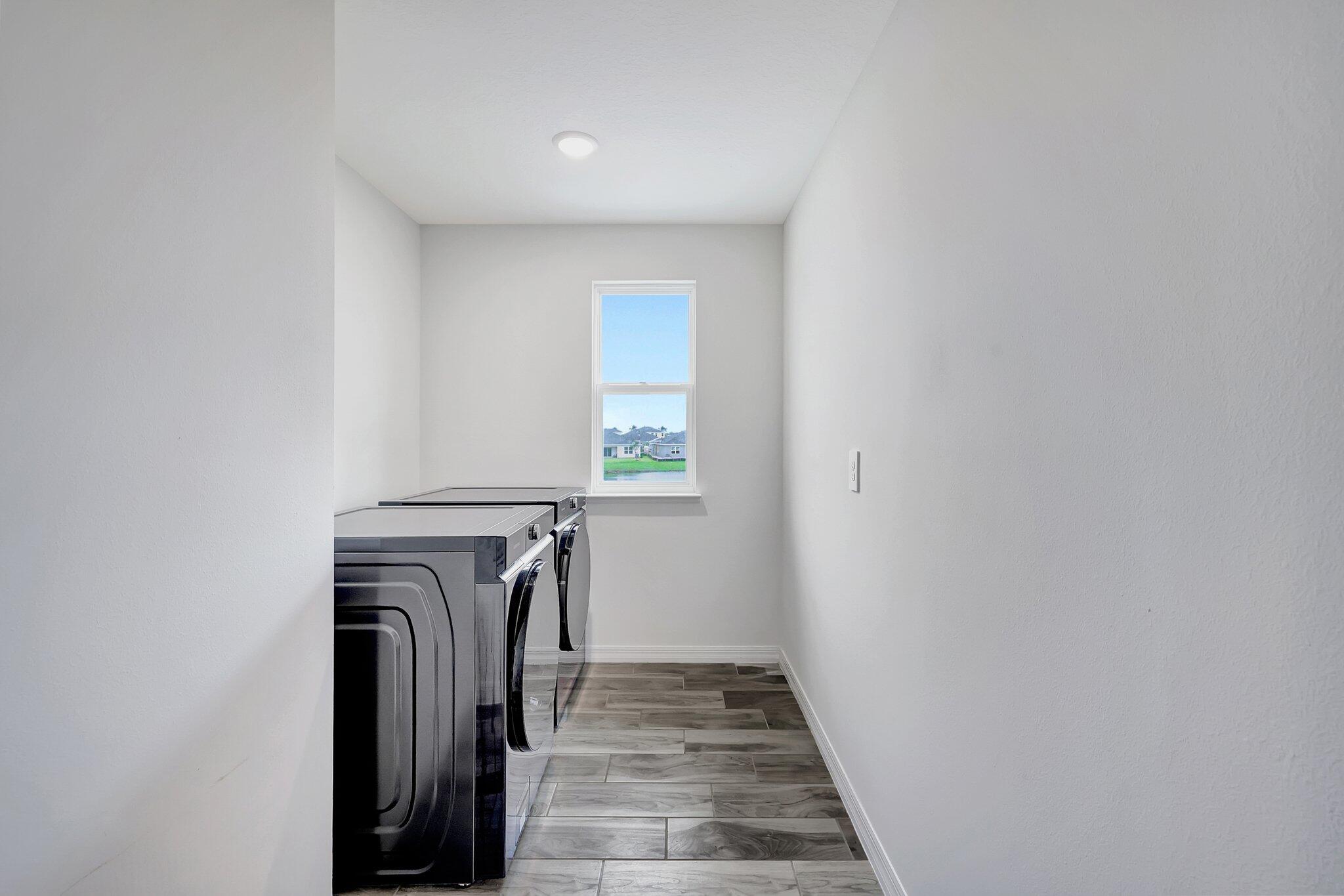 9398 Serapis Way Port St. Lucie, FL 34987 - Photo 28 of 50 a view of entryway with washer and dryer