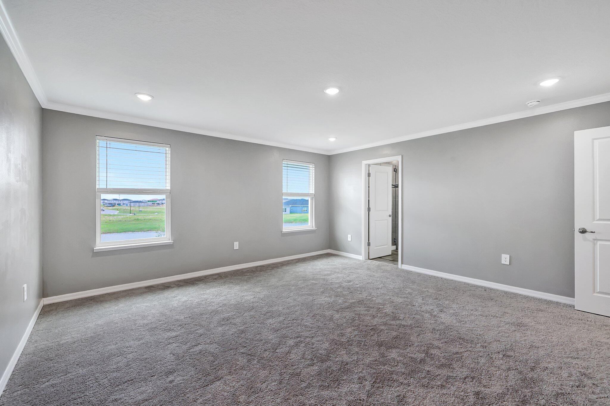 9398 Serapis Way Port St. Lucie, FL 34987 - Photo 32 of 50 an empty room with windows and closet