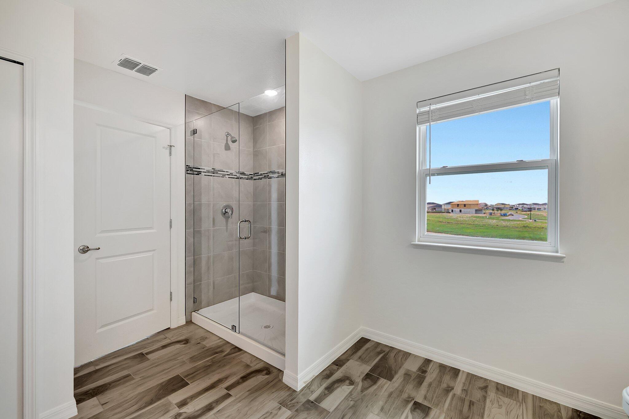 9398 Serapis Way Port St. Lucie, FL 34987 - Photo 34 of 50 a bathroom with a bathtub and a shower