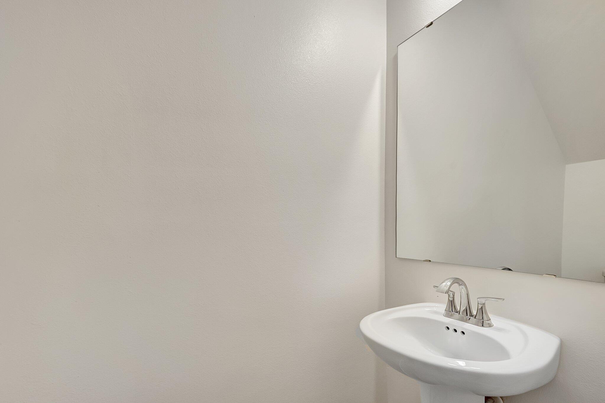 9398 Serapis Way Port St. Lucie, FL 34987 - Photo 43 of 50 a bathroom with a sink and a mirror