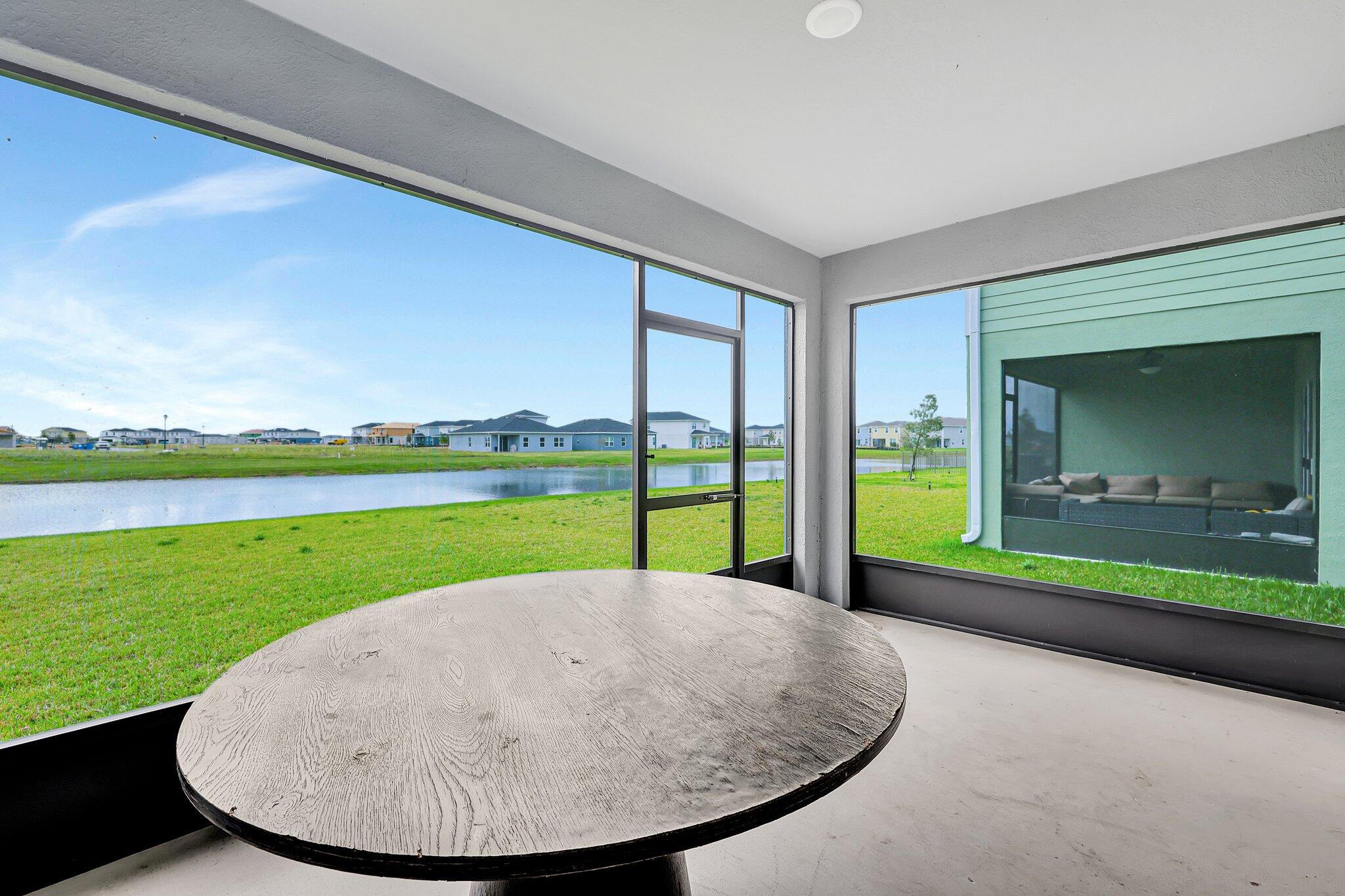 9398 Serapis Way Port St. Lucie, FL 34987 - Photo 44 of 50 a view of a swimming pool with an outdoor seating