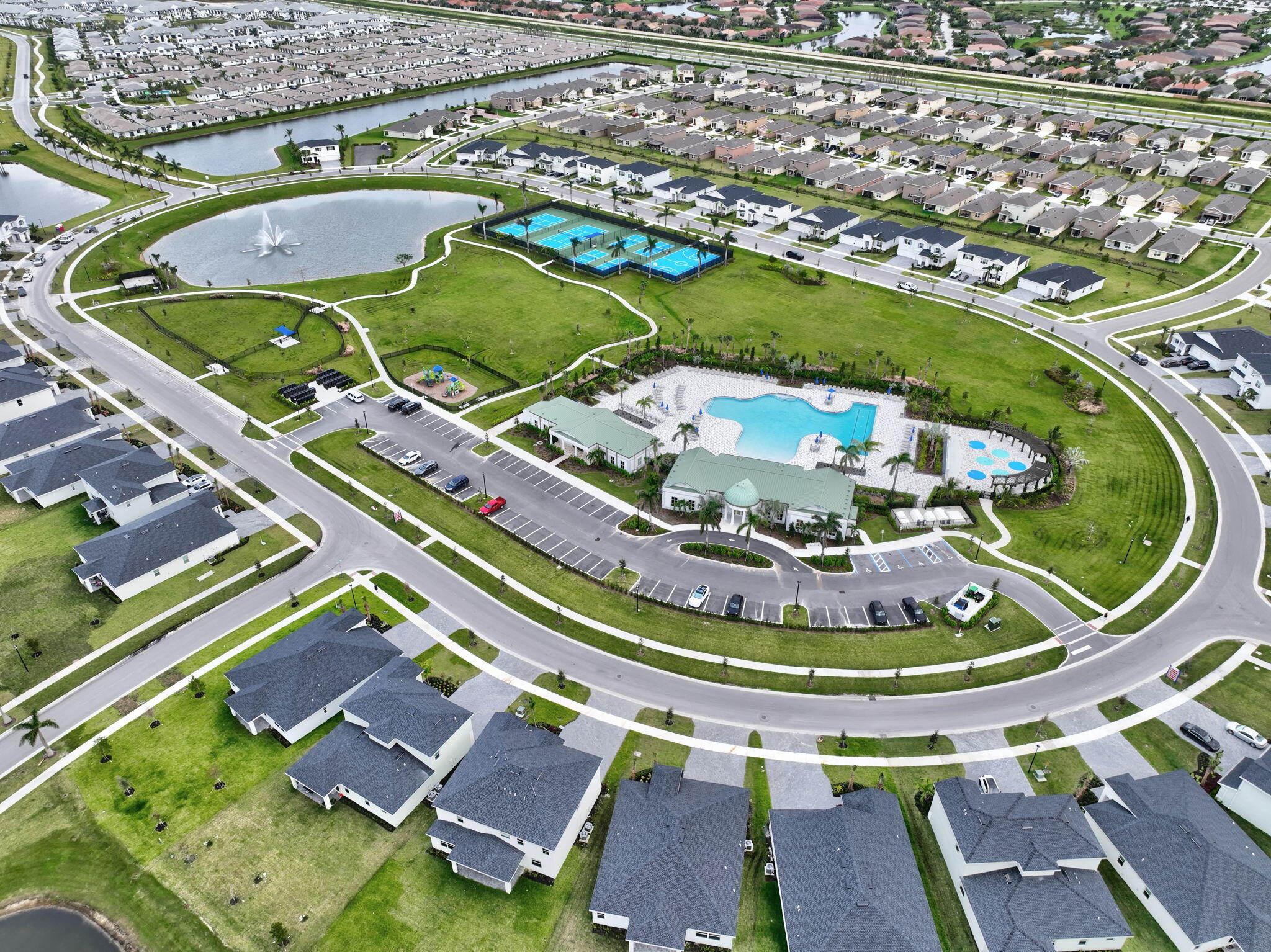 9398 Serapis Way Port St. Lucie, FL 34987 - Photo 45 of 50 an aerial view of a house with a swimming pool yard and outdoor seating