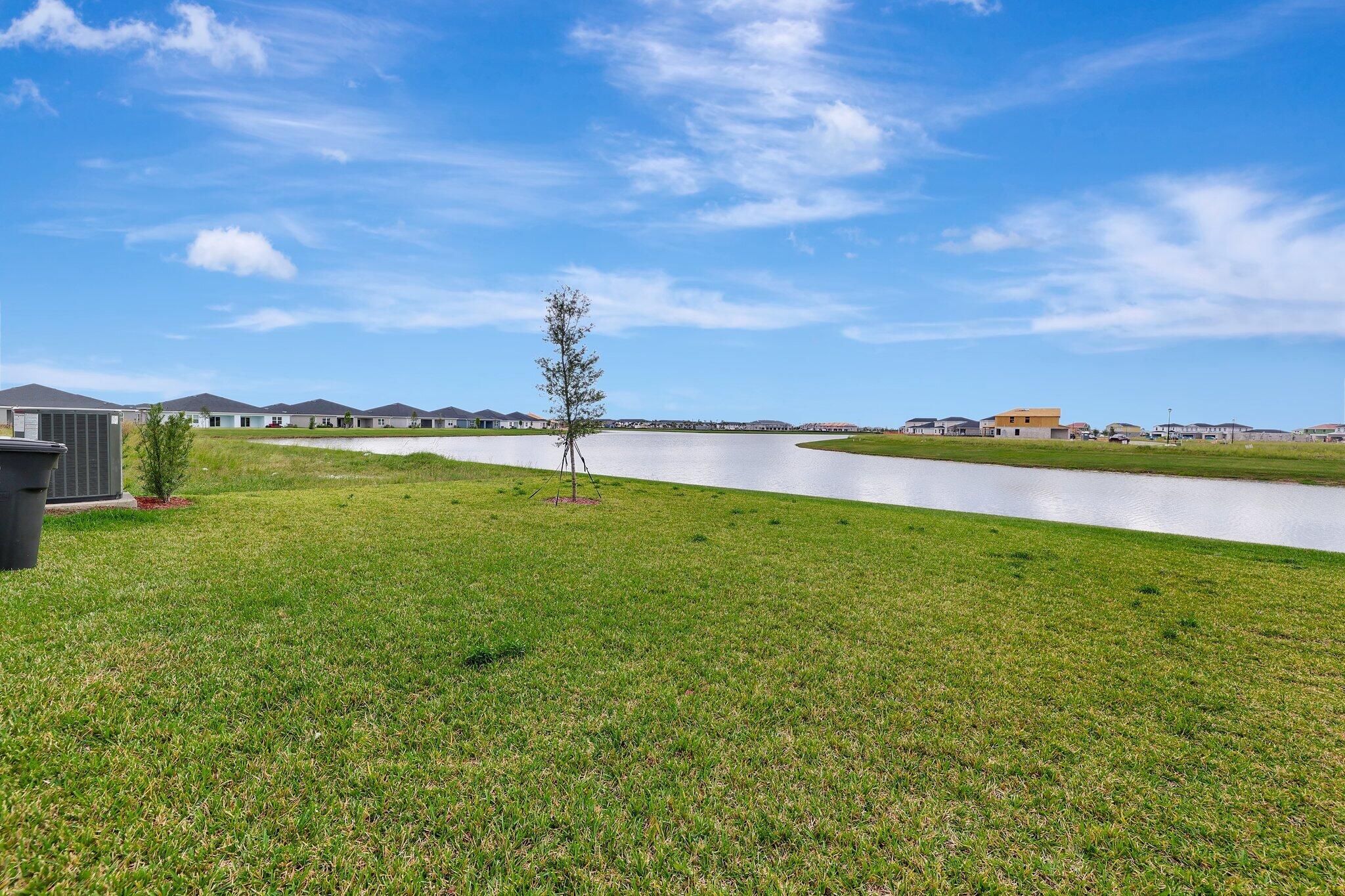 9398 Serapis Way Port St. Lucie, FL 34987 - Photo 50 of 50 a view of a lake with a big yard