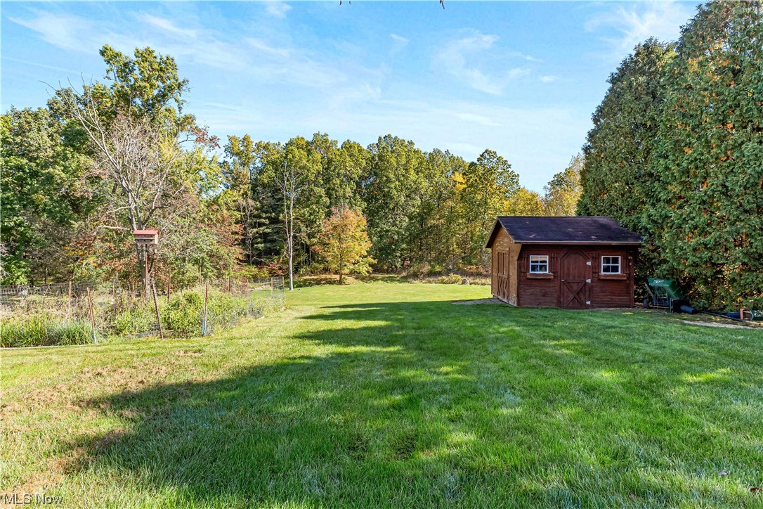 319 Glenview Road Canfield, OH 44406 - Photo 25 of 31 View of yard with a storage shed
