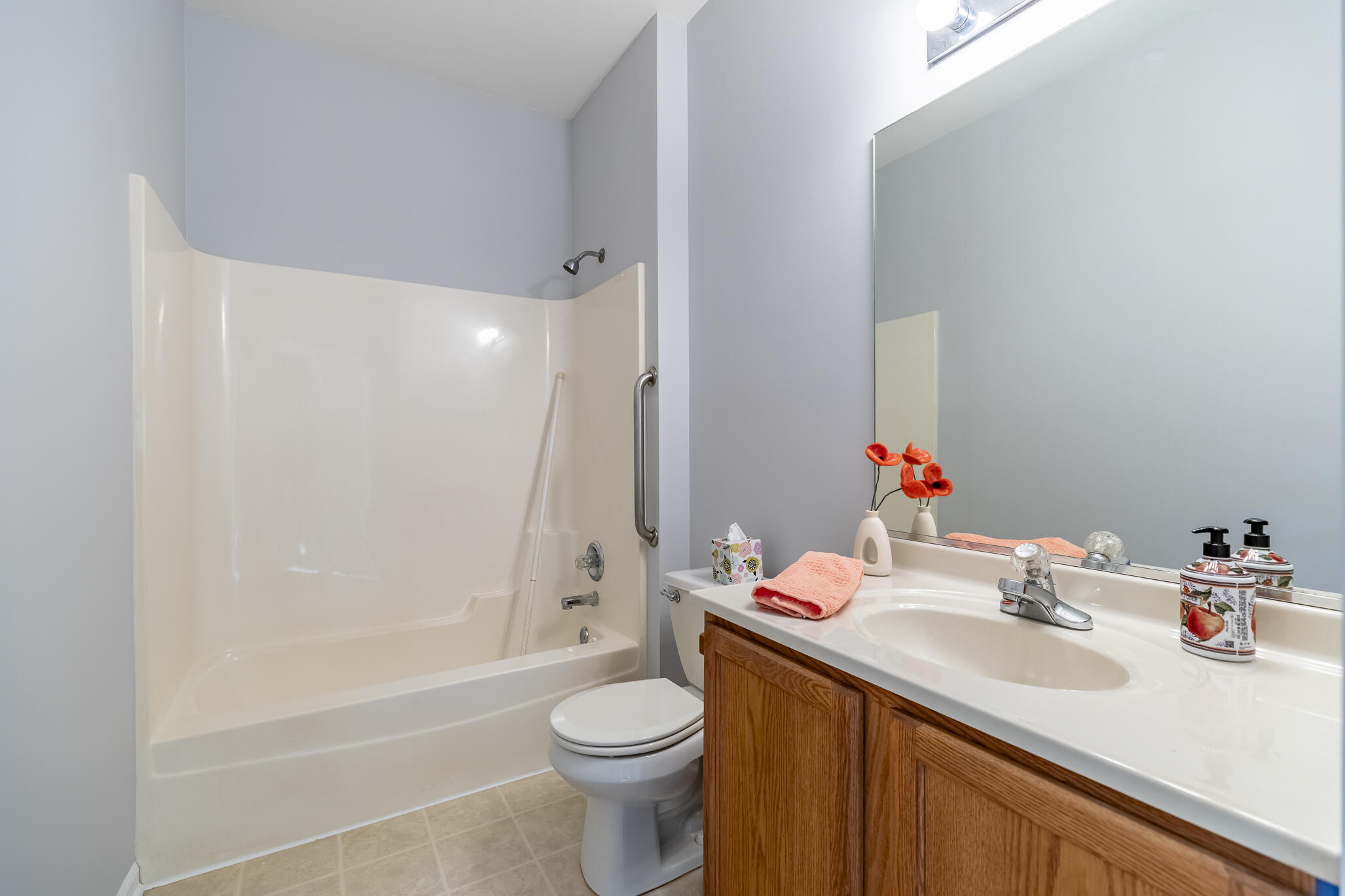 1253 Primrose Lane Schererville, IN 46375 - Photo 13 of 19 a bathroom with a sink vanity mirror and toilet