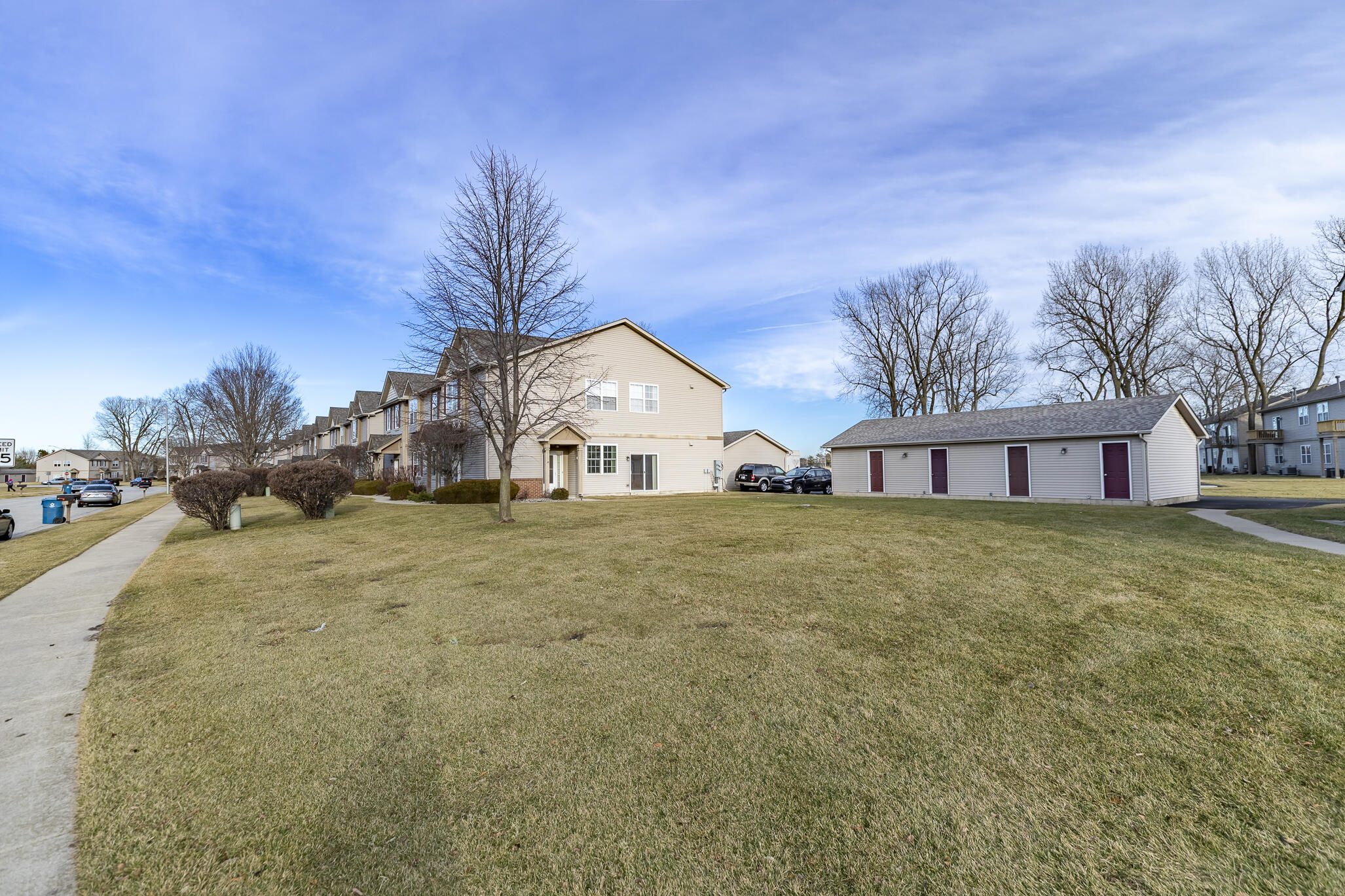 1253 Primrose Lane Schererville, IN 46375 - Photo 3 of 19 a front view of a house with a yard