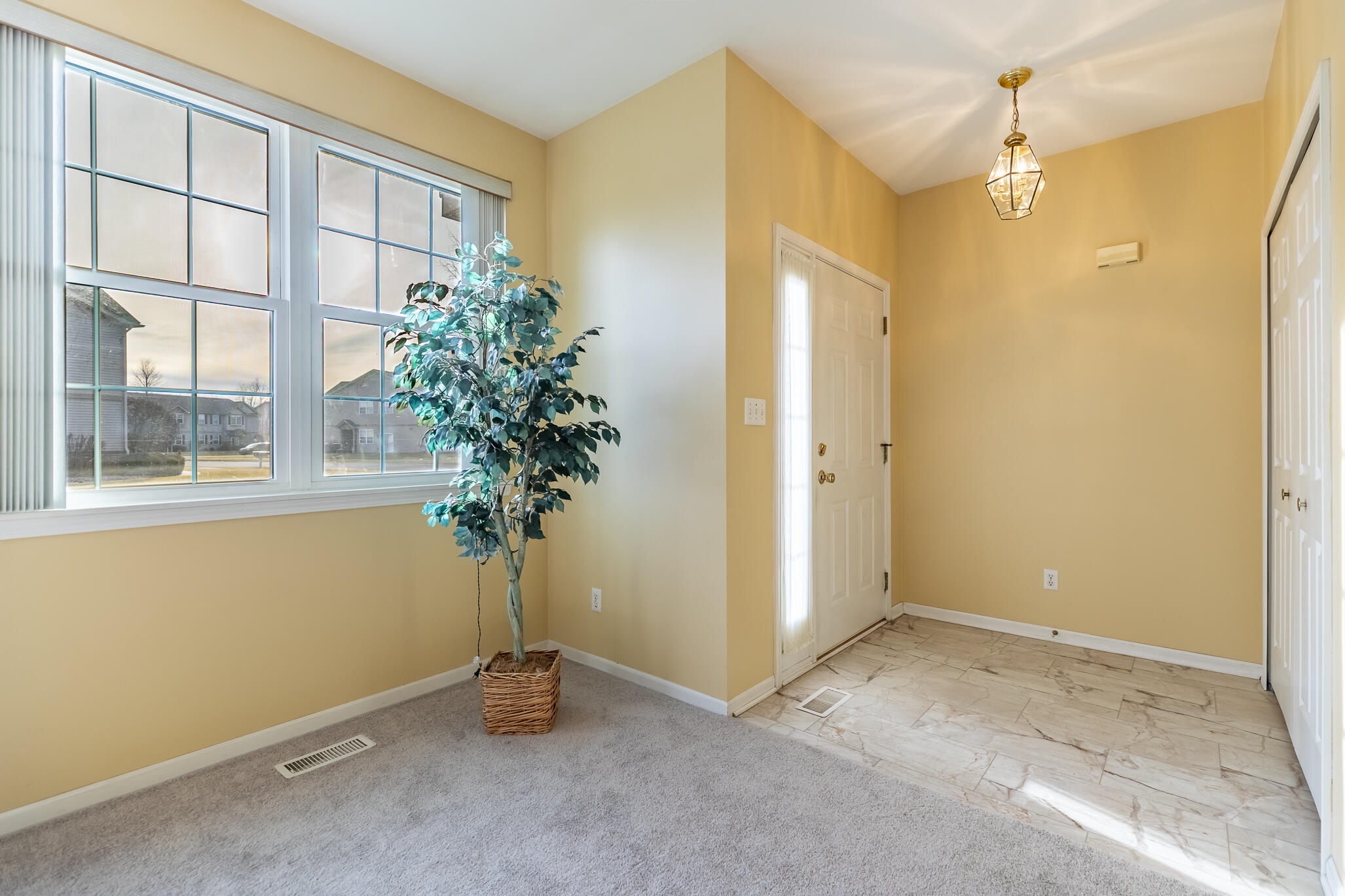 1253 Primrose Lane Schererville, IN 46375 - Photo 4 of 19 a view of an empty room with a window