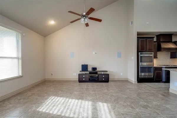 a view of a kitchen with a sink and a refrigerator