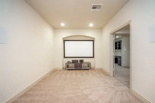 a bathroom with a sink a toilet and shower curtain