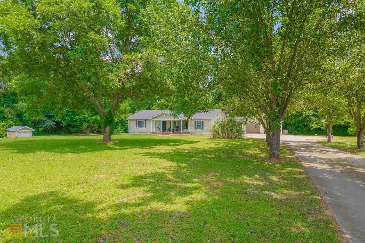 1187 Nancy Hart School Road Hartwell, GA 30643 - Photo 1 of 1 a front view of a house with garden