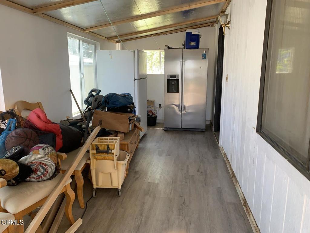 10200 Johnson Road, Unit 52 Phelan, CA 92371 - Photo 13 of 13 a living room with furniture and a wooden floor