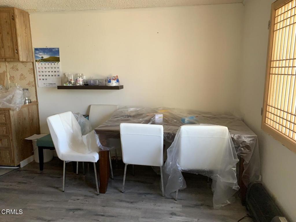 10200 Johnson Road, Unit 52 Phelan, CA 92371 - Photo 10 of 13 a view of a dining room with furniture and window