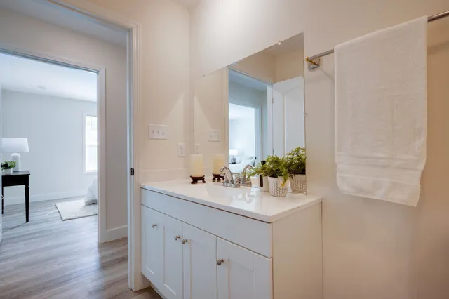 a bedroom with a bed and chair