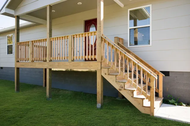 a view of balcony with furniture