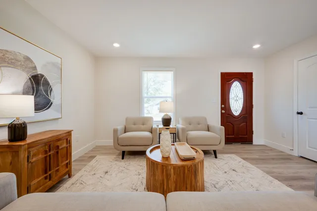 a living room with furniture and a window