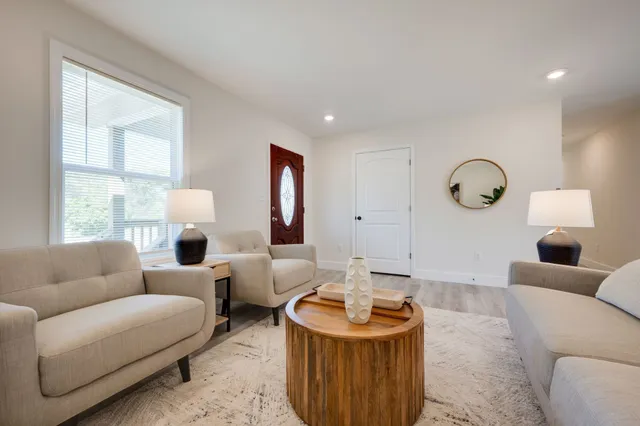 a living room with furniture and a large window
