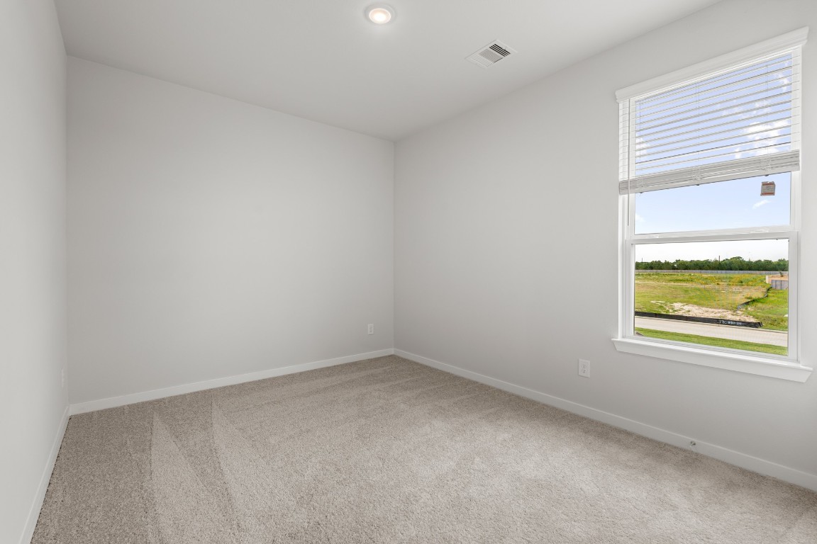 641 Pomegranate Lane La Marque, TX 77568 - Photo 16 of 22 an empty room with a window