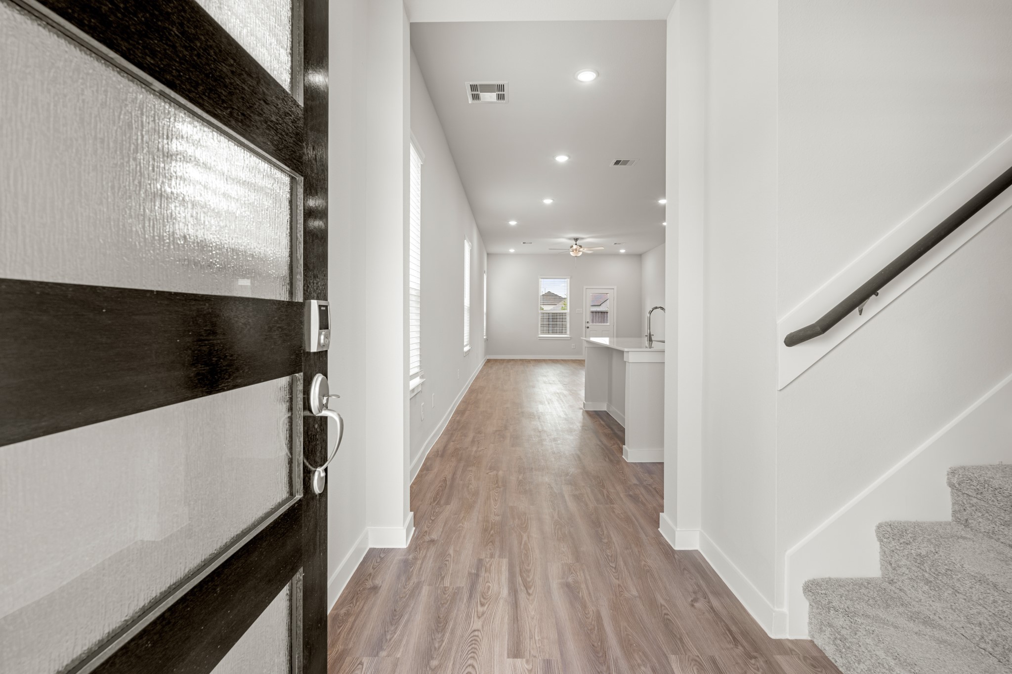 641 Pomegranate Lane La Marque, TX 77568 - Photo 2 of 22 a view of a hallway with wooden floor and staircase