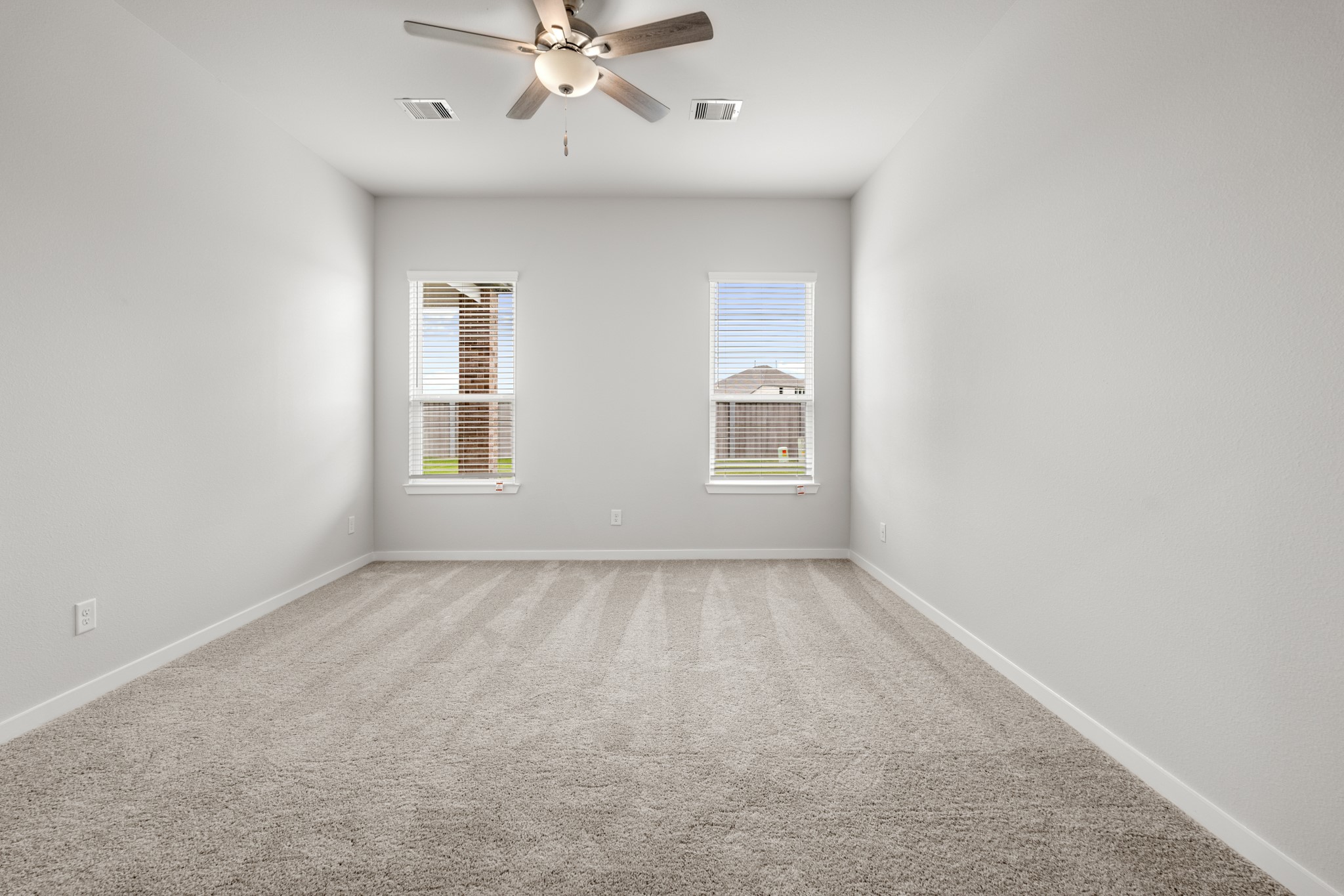 641 Pomegranate Lane La Marque, TX 77568 - Photo 10 of 22 an empty room with windows and fan